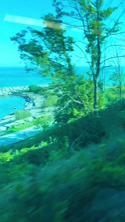 View of Sea From Train Window Running Along The Coastline Stock Footage 258071279
