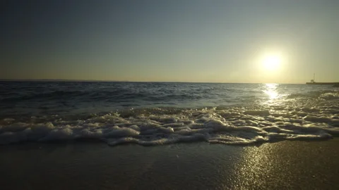 View of sea waves and sunset at beach Stock Footage 212947807
