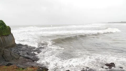 View of sea waves containing white foam striking sea shore Video stock 191442670
