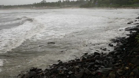 View of sea waves containing white foam striking sea shore Video stock 191444177
