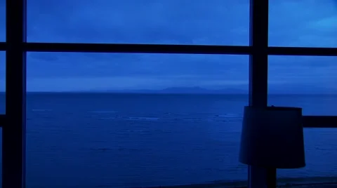 View of sea from window at dusk Stock Footage 60690973