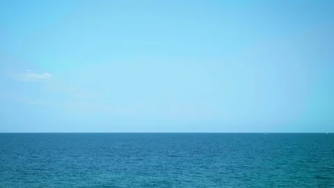 View of the sea from window of moving train. Train is leaving Barcelona. Stock Footage 118434434