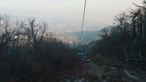 View from seat of moving cableway in suburb of Budapest in winter Video stock 128300741