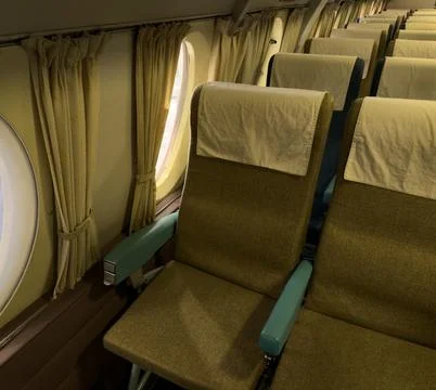View of seats inside an old passenger plane showing retro style Stock Photos