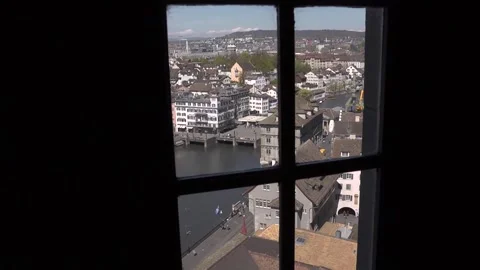 A view of a section of Zurich and the Limmat River as seen through a window. Stock Footage 286045710
