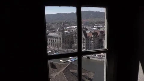 A view of a section of Zurich and the Limmat River as seen through a window. Stock Footage 286045715