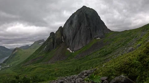 View of Segla mountain peak with rocky boulder foreground in Senja Norway Stock-Footage 342059389