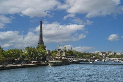 View of the Seine River in Paris with the Eiffel Tower in the background. Stock Photos