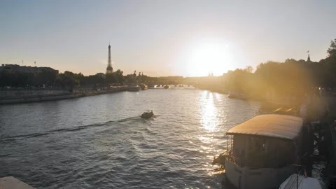 View of the Senna riverfront with a passing boat and the Eiffel Tower in the Stock Footage 277535090