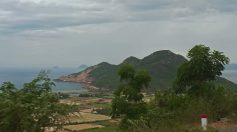 View of Separated Rural Peasant Fields against Sea Hill Stock Footage 66855393