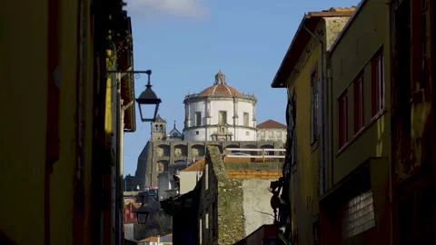 View of the Serra do Pilar Monastery through a narrow historic alley. Stock Footage 327624595