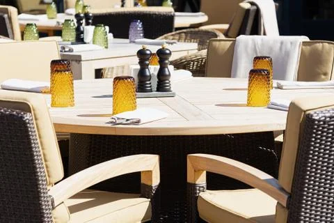 View of the served tables of the restaurant at which no one is sitting. Conce Stock Photos