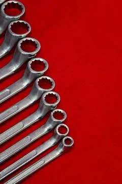 View of set of wrenches on red background Stock Photos