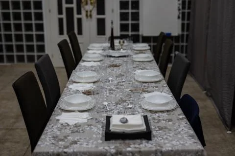 View of a settled table for dinner with no people Stock Photos