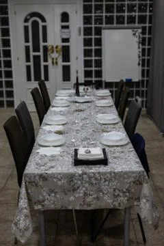 View of a settled table for dinner with no people Stock Photos