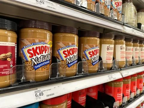 View of several jars of Skippy peanut butter on display at a local Target Stock Photos