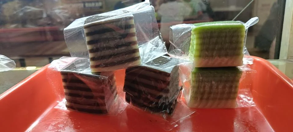 View of several layer cakes on a red tray Stock Photos