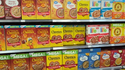 View of Several Shelves Dedicated to Packages of Great Value Cereal on Disp.. Stock Footage 296890308