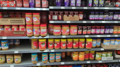 View of Several Shelves Dedicated to Peanut Butter on Display at Walmart. P.. Stock Footage 296890171