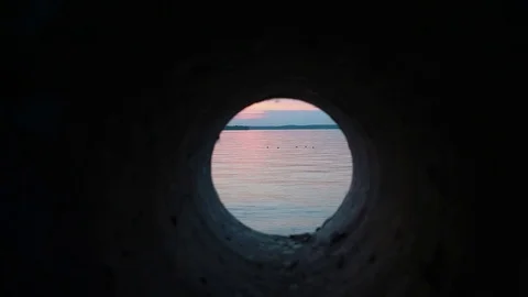View from the sewer to the lake during sunset Stock Footage 78986274