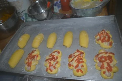 View of shaped and filled bread dough and topping Stock Photos