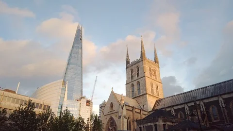 View of The Shard skyscraper, through the old building of Southwark Cathedral Stock Footage 113395398
