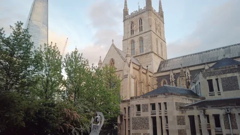 View of The Shard skyscraper, through the old building of Southwark Cathedral Stock Footage 113395696
