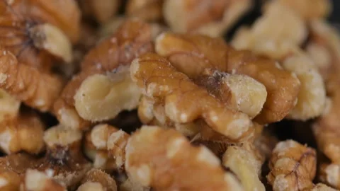 View of shelled walnuts. Shelled walnuts in a heap. Peeled walnuts. Macro Stock Footage 296384939