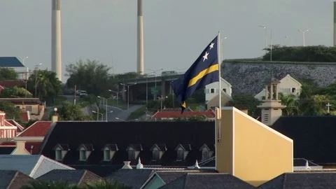 View from a ship as the camera tracks the flag of Curacao Stock Footage 75931149