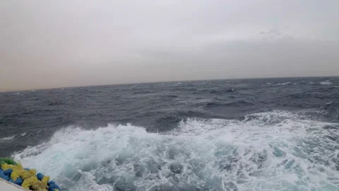 View from a ship moving along the waves in a strong storm in the Red Sea Stock Footage 114929393