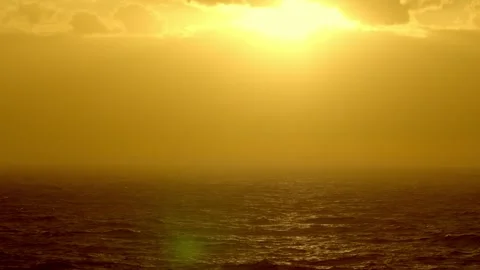 View from a ship of ocean waves going by at sunset on the Caribbean Sea. Stock Footage 313544813