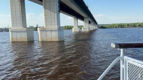 View from the ship passing beneath a highway bridge, showcasing steel structu Stock Footage 310613208
