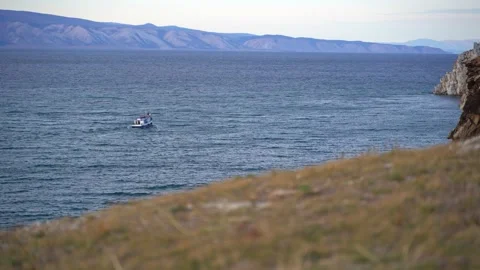 View of a ship passing through the waters on Lake Baikal, Russia, Siberia Stock Footage 132100451