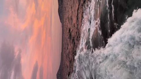 View from the ship to the red island - Vertical stock video Stock Footage 240327900