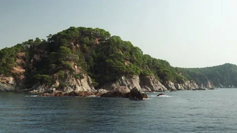 View from the ship to the rocky terrain in Tossa de Mar Stock Footage 171424435