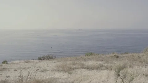View of the ship in the sea from the shore Video stock 80249999