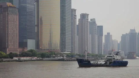 View of Ships through the skyline of Shanghai Stock Footage 40700681
