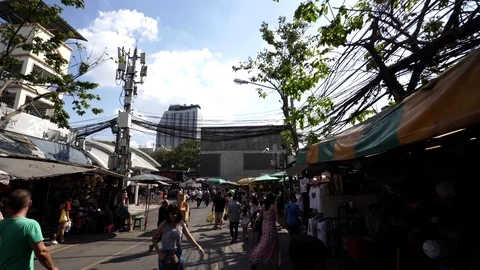 View of shops in Chatuchak Market with crowds visiting. Stock Footage 101557725