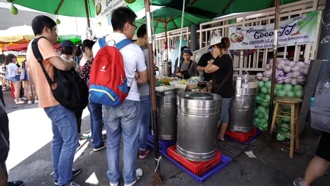 View of shops in Chatuchak Market with crowds visiting. Stock Footage 101557738