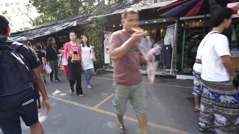 View of shops in Chatuchak Market with crowds visiting. Stock Footage 101557757