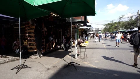 View of shops in Chatuchak Market with crowds visiting. Stock Footage 101557818
