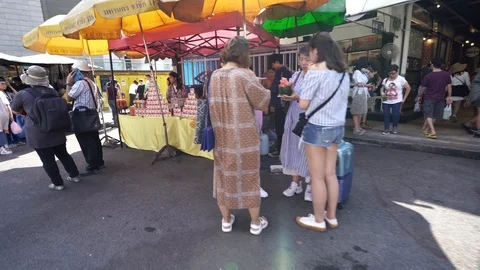 View of shops in Chatuchak Market with crowds visiting. Stock Footage 101557846