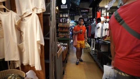 View of shops in Chatuchak Market with crowds visiting. Stock Footage 101558236