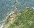 View of shore at base of cliff SD Footage