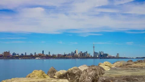 View from shore to harbor surrounded huge skyscrapers and CN Tower, Toronto Stock Footage 248618072