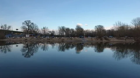 View of the shore from the river Stockbeeldmateriaal 76818694