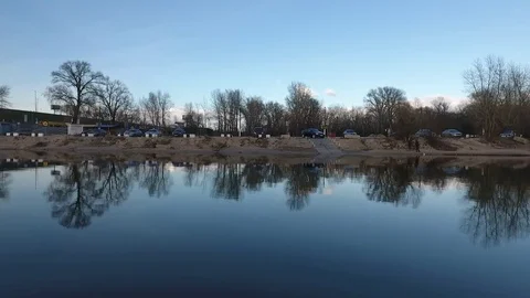 View of the shore from the river Stockbeeldmateriaal 76818703