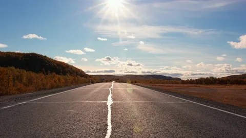 View shot along an empty desert highway in the sunlight. Shot om BMPCC 6K Sigma Video stock 162613220