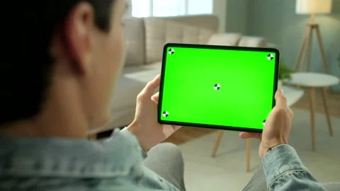 View From the Shoulder of Man Using Hand Gestures on Green Mock-up Screen Stock Footage 133281369