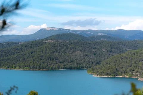 View of the Shrine of Torreciudad from El Grado dam, Aragon, Spain. Stock Photos